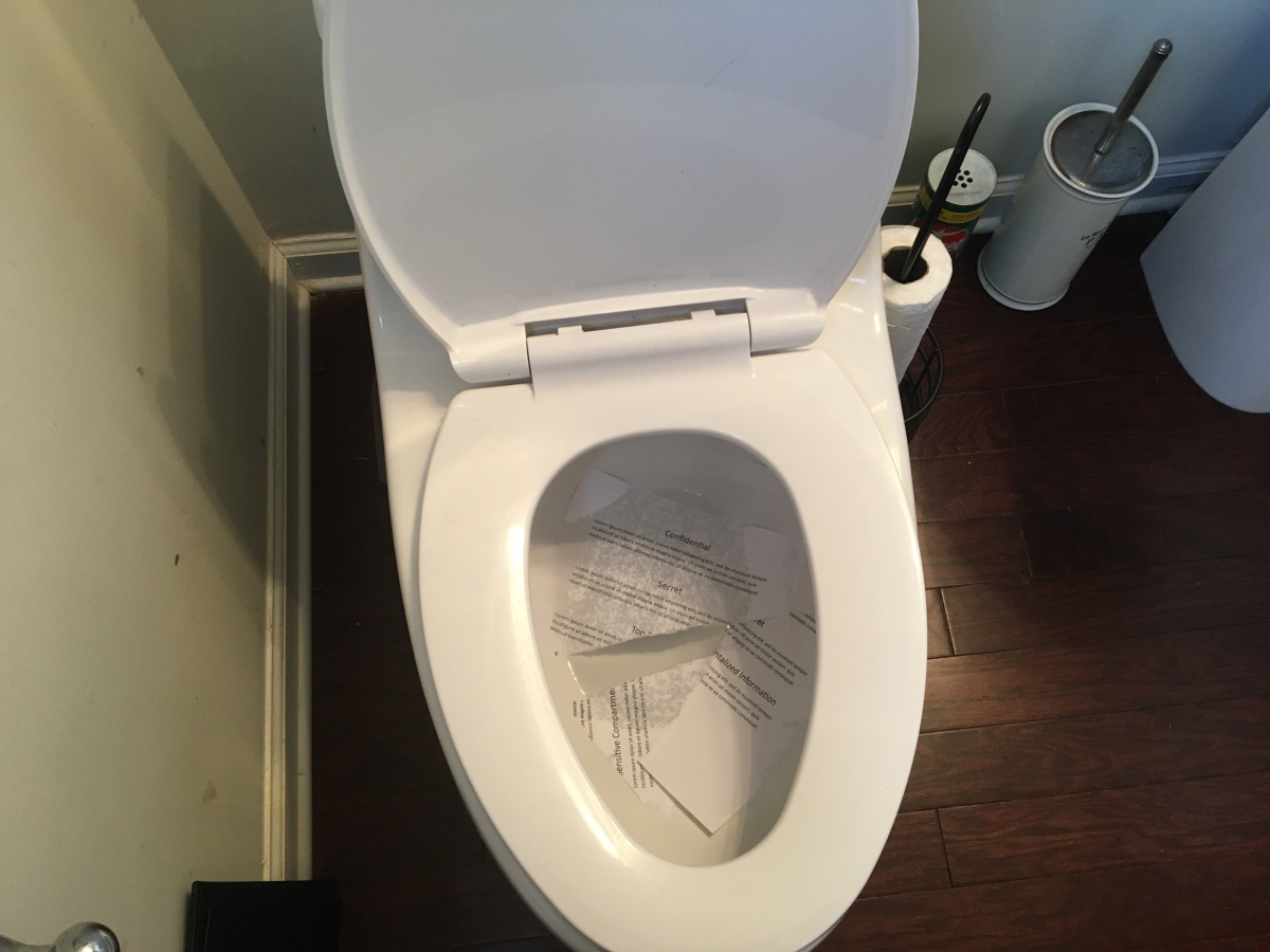 toilet with mock classified documents