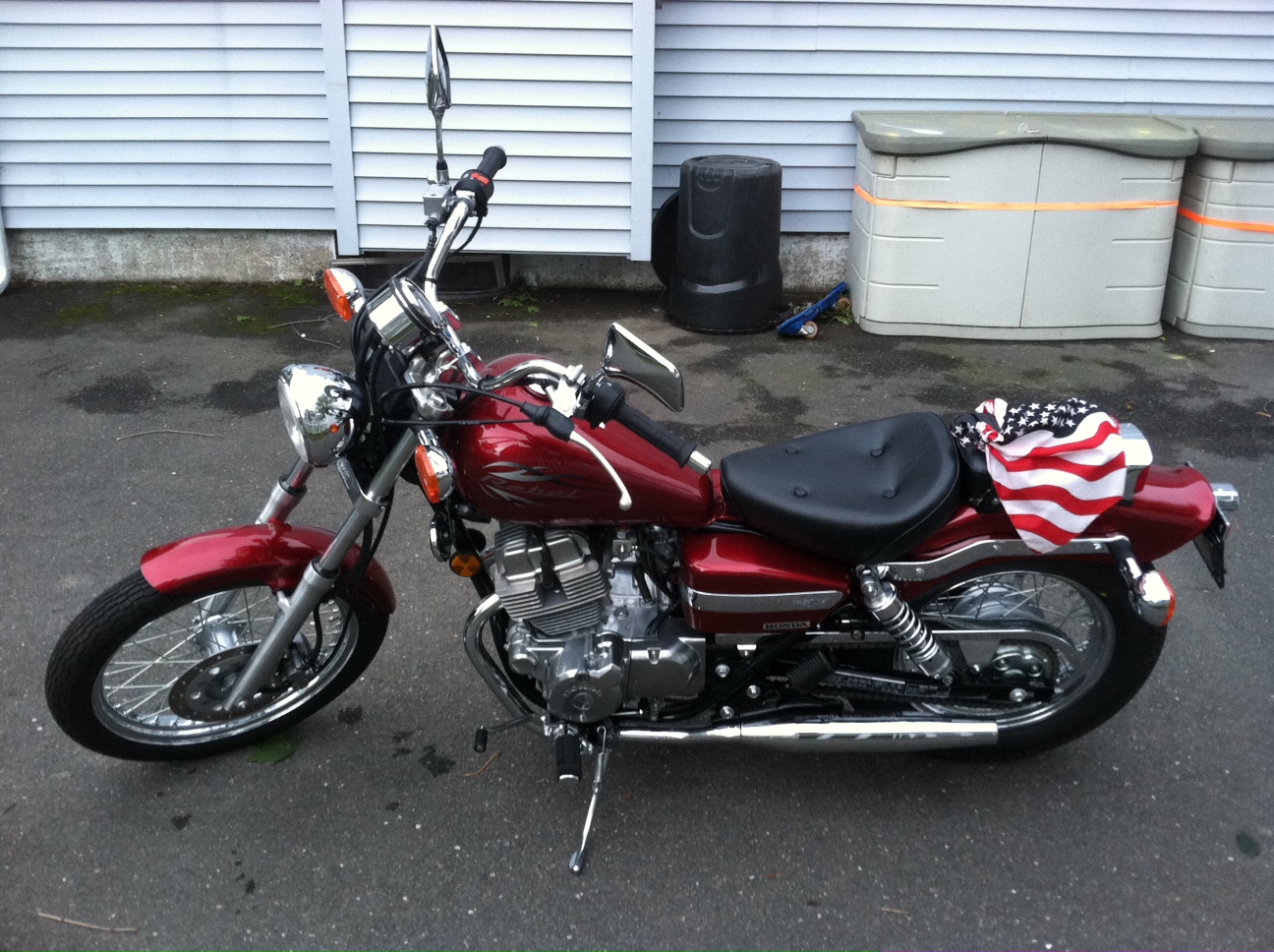 Candy Red 2012 Honda Rebel motorcycle adorned with American flag bandana from the 2012 CT United Ride