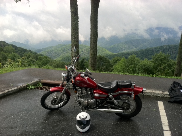 Candy Red 2012 Honda Rebel motorcycle with foggy scenic view in Bryson City, North Carolina. Honda Rebel 250s were among the typical bikes used in the Basic Rider Class