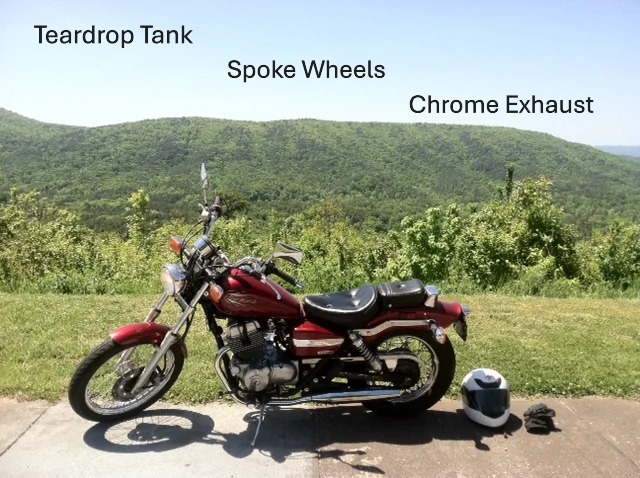 Candy Red 2012 Honda Rebel motorcycle with scenic view