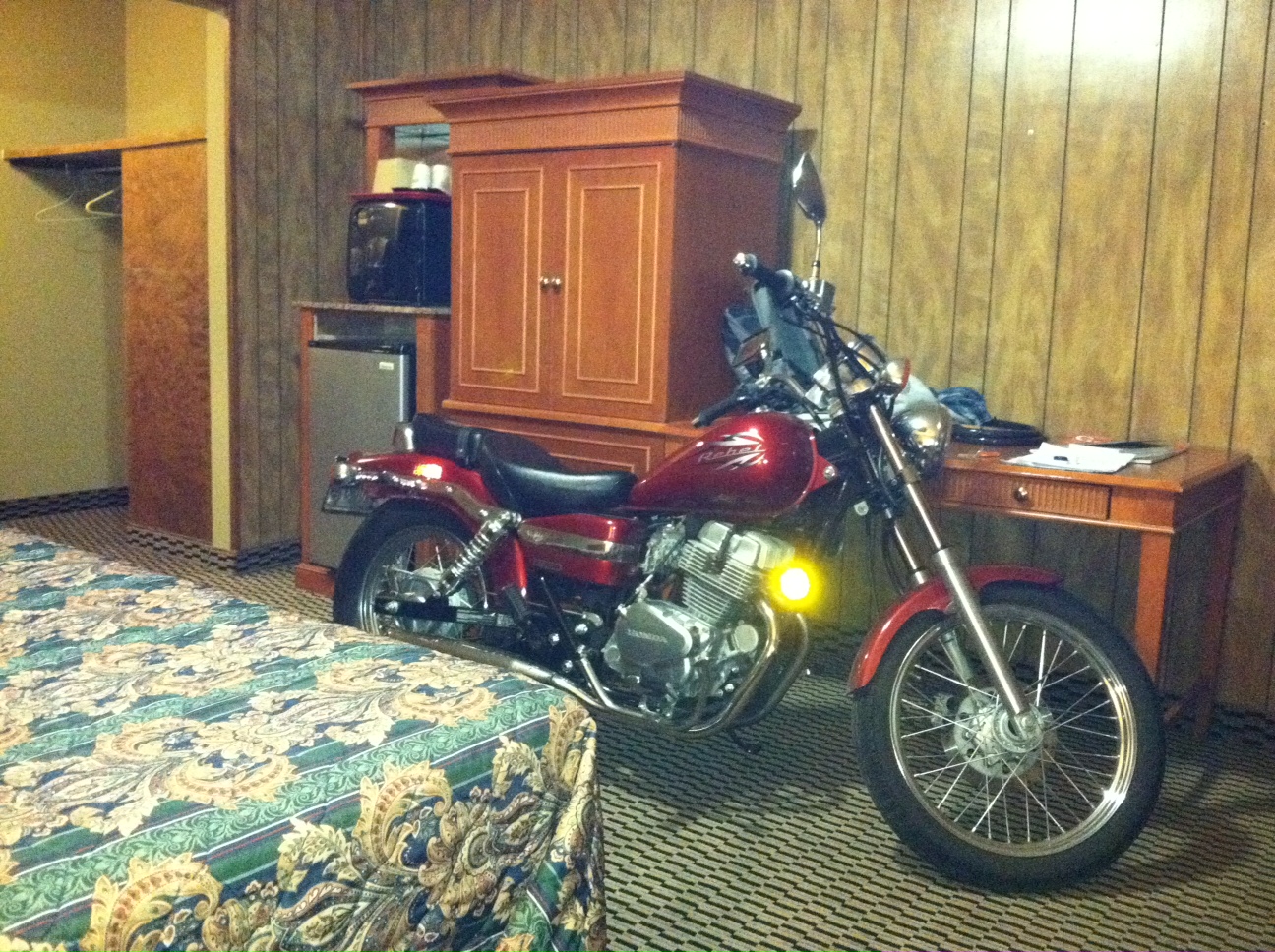 Candy Red 2012 Honda Rebel motorcycle kept safe and sound overnight in a South Carolina motel room